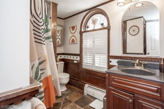 bathroom featuring crown molding, a wealth of natural light, toilet, and baseboard heating