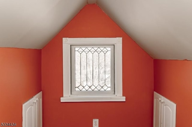 bonus room with vaulted ceiling