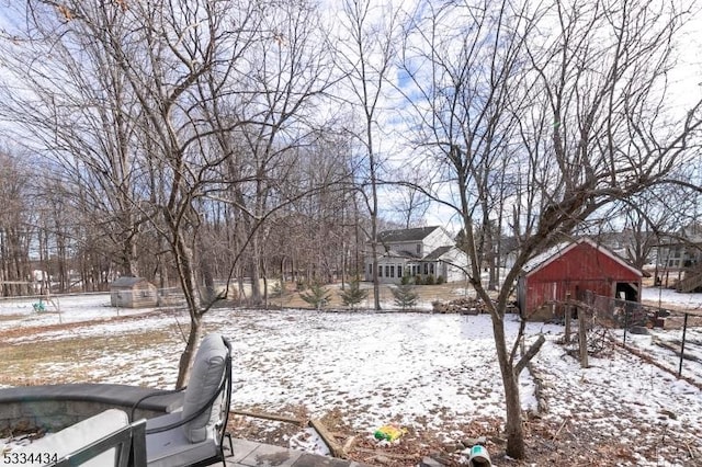 view of yard layered in snow