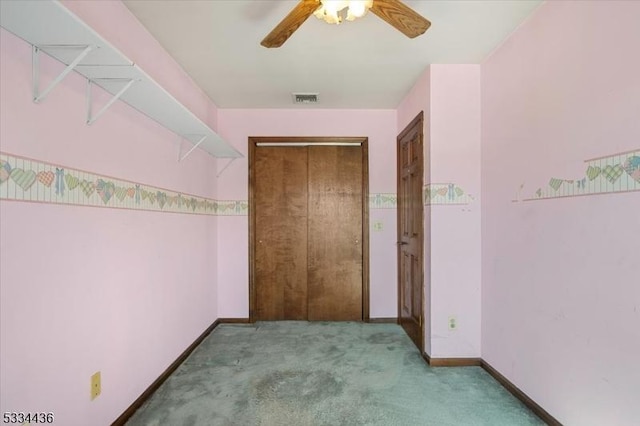 interior space with carpet floors, visible vents, and baseboards