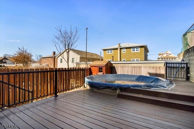 deck with a fenced backyard and a residential view