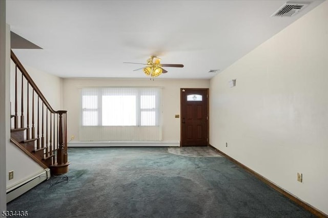 carpeted entrance foyer featuring visible vents, baseboard heating, ceiling fan, baseboards, and stairs