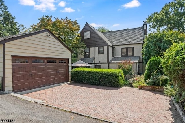 view of front of house featuring an outbuilding and a garage