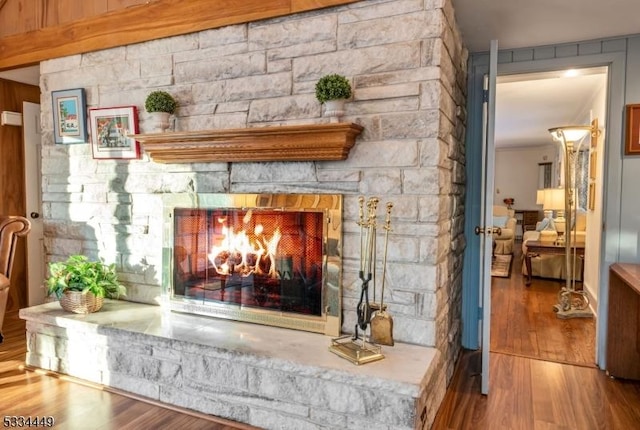 interior details with hardwood / wood-style flooring and a fireplace