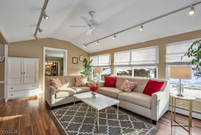 living room with wood-type flooring, lofted ceiling, ceiling fan with notable chandelier, and baseboard heating