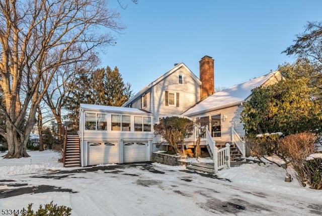 view of front of home featuring a sunroom