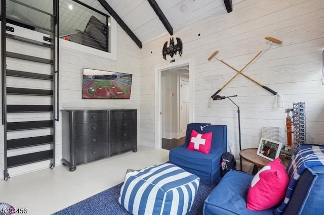 living area featuring concrete flooring, high vaulted ceiling, and beam ceiling