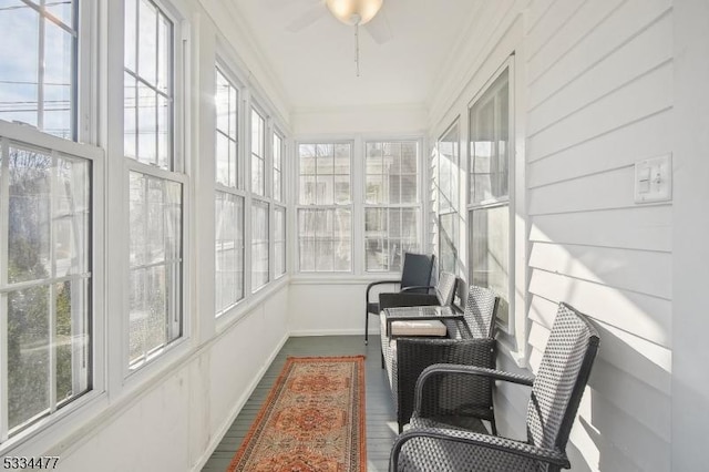 sunroom / solarium with ceiling fan and a wealth of natural light