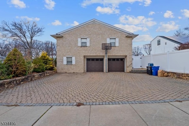 view of side of home featuring a garage