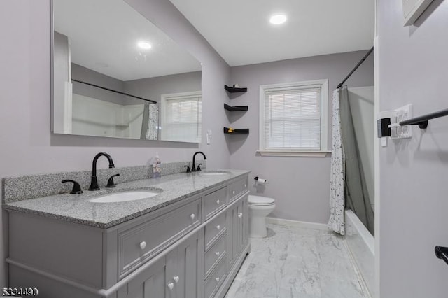 full bathroom with vanity, a healthy amount of sunlight, shower / tub combo, and toilet