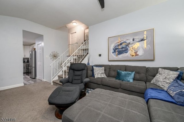 carpeted living room with vaulted ceiling