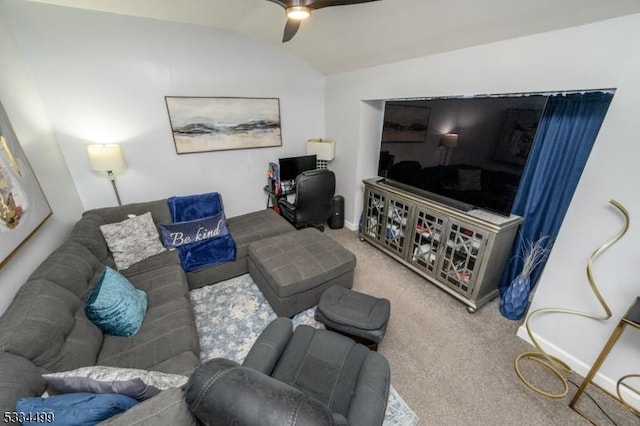 carpeted living room with vaulted ceiling and ceiling fan