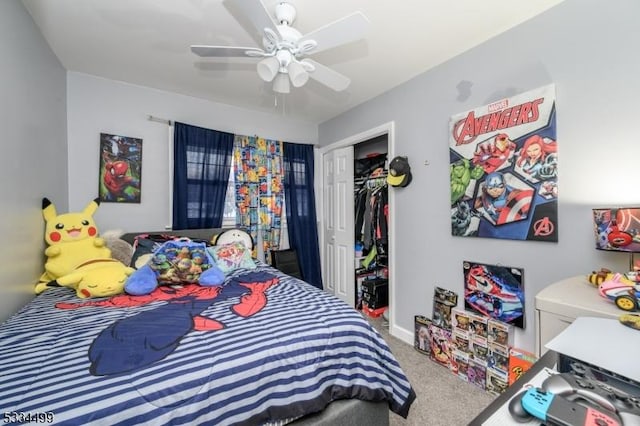 carpeted bedroom featuring a closet and ceiling fan