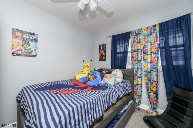 carpeted bedroom featuring ceiling fan