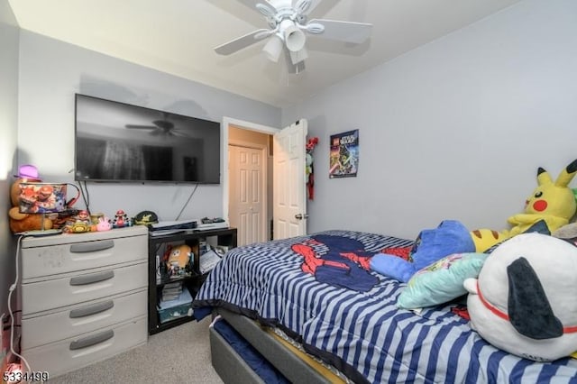 bedroom with ceiling fan and carpet