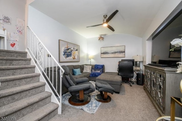 carpeted living room featuring vaulted ceiling, brick ceiling, and ceiling fan