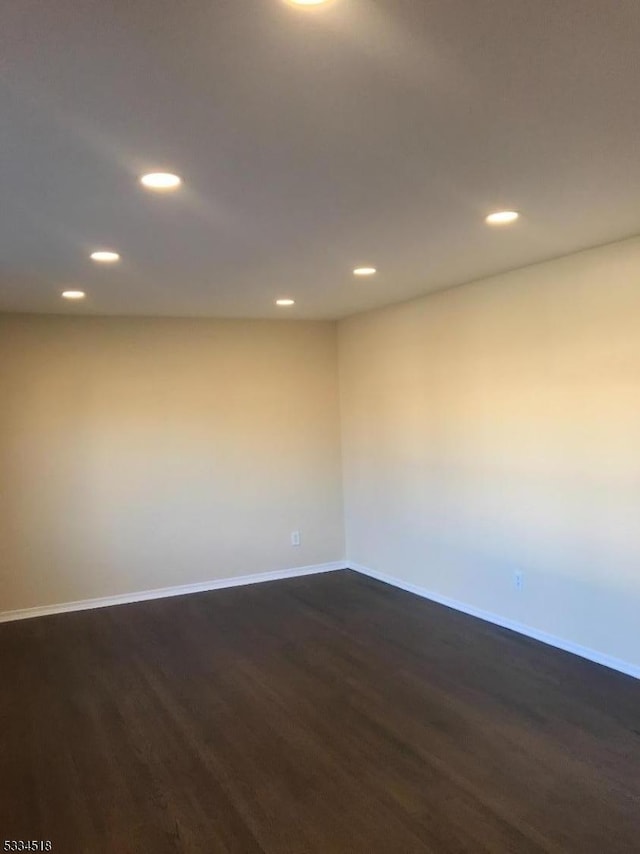 empty room featuring dark hardwood / wood-style floors