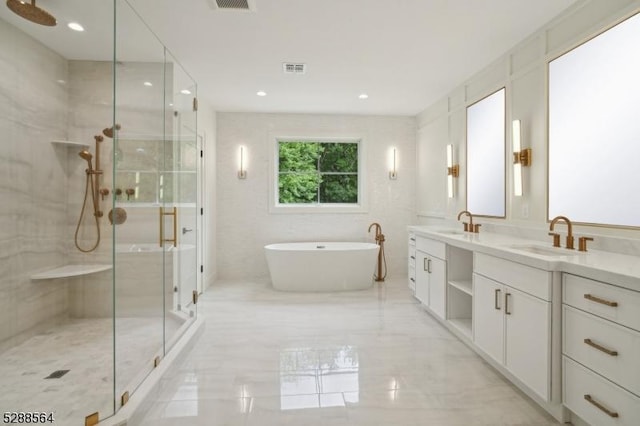 bathroom featuring plus walk in shower and vanity