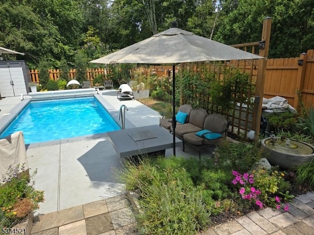 view of pool featuring a patio area