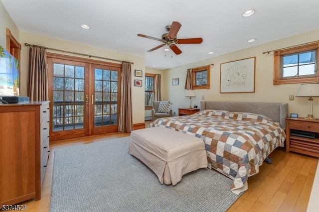 bedroom with multiple windows, access to exterior, french doors, and ceiling fan