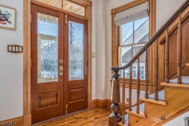 entryway featuring french doors and light wood-type flooring