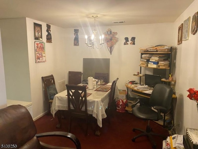 dining space with a notable chandelier