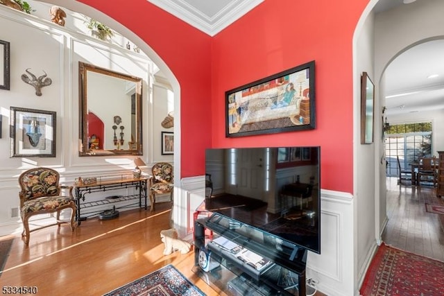 interior space with crown molding and wood-type flooring