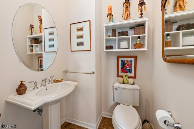 bathroom with tile patterned floors and toilet