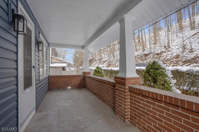 view of snow covered patio