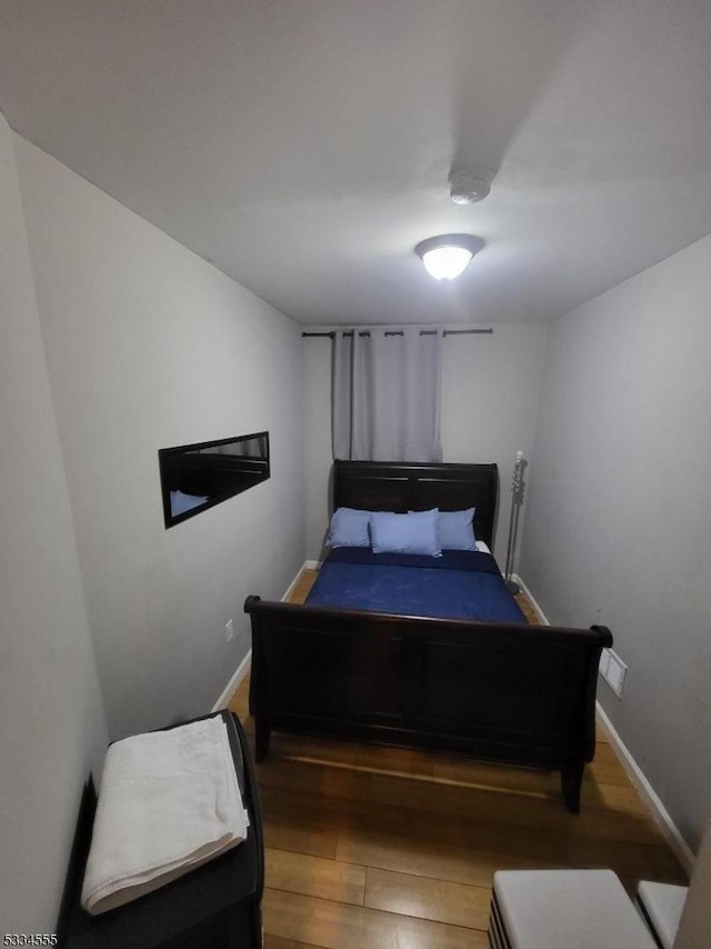 bedroom featuring hardwood / wood-style floors