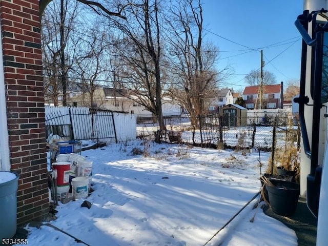 view of yard covered in snow