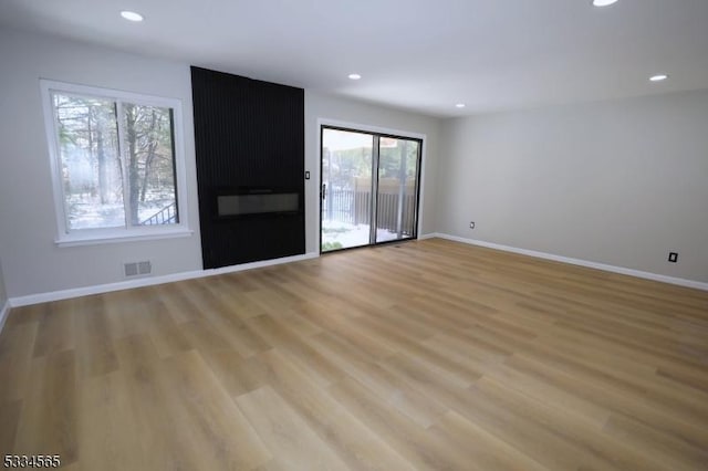 spare room with light wood-type flooring