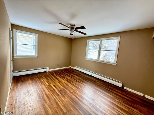 unfurnished room with dark hardwood / wood-style flooring, a baseboard radiator, and ceiling fan