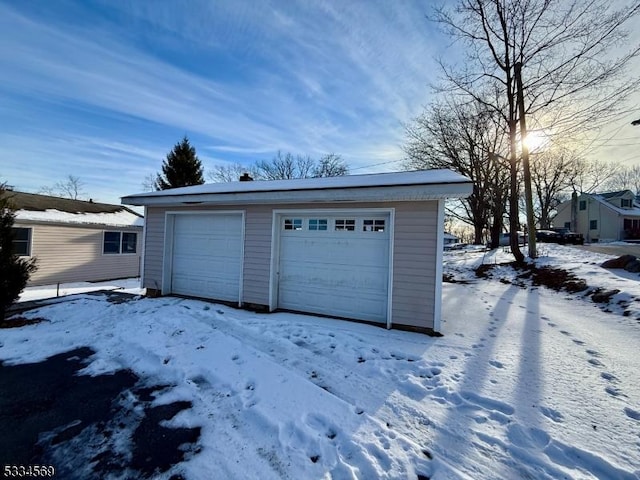 view of snow covered garage