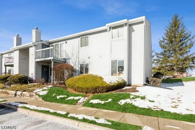 rear view of house with a balcony