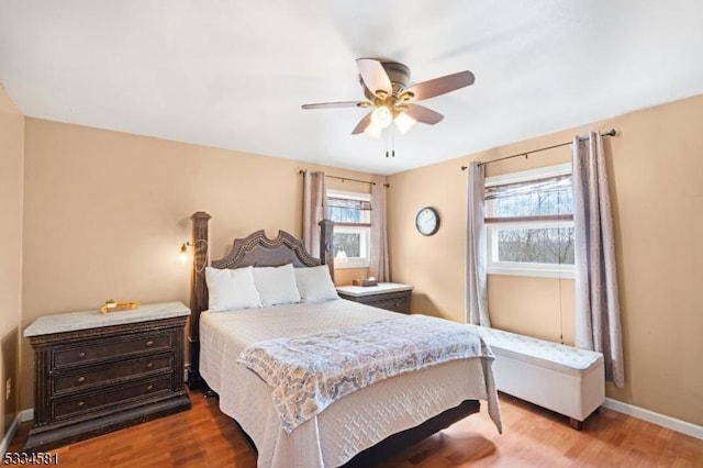 bedroom with hardwood / wood-style flooring and ceiling fan