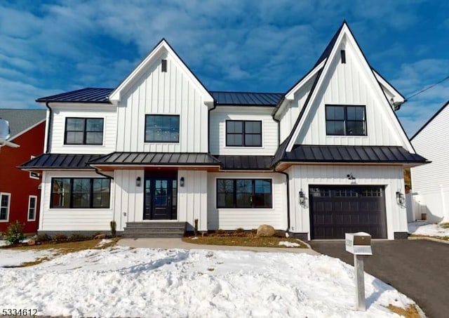 modern farmhouse style home featuring a garage