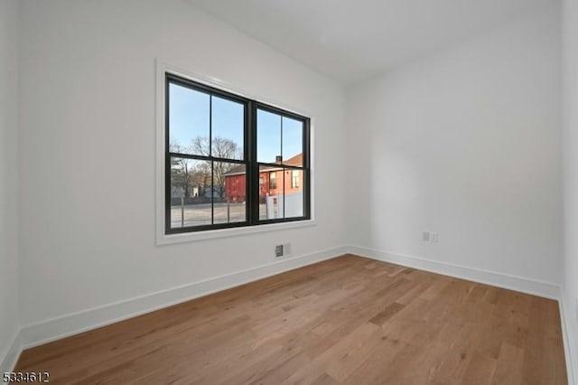 unfurnished room featuring light wood-type flooring