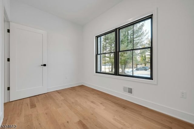 empty room with light wood-type flooring