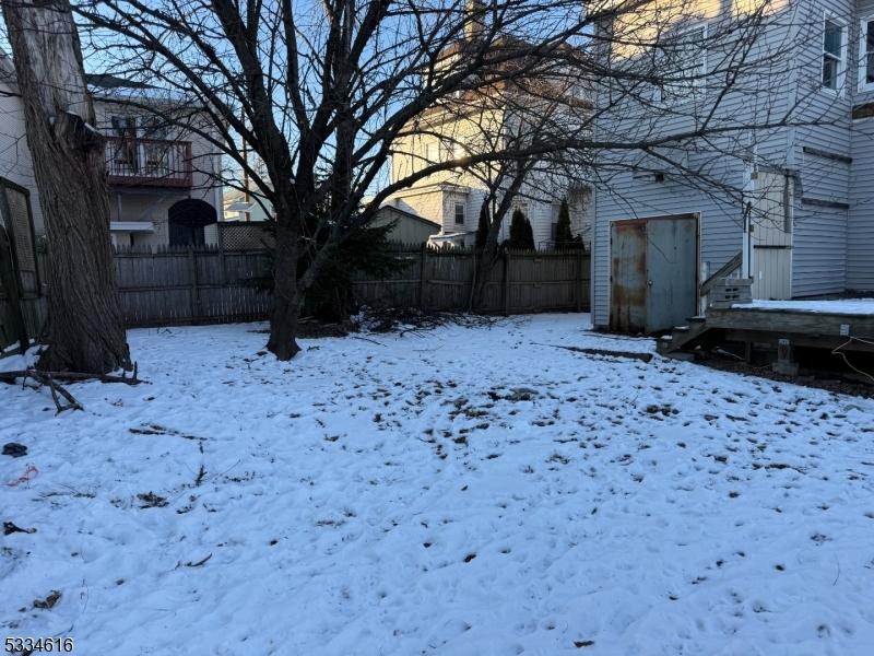 view of yard layered in snow