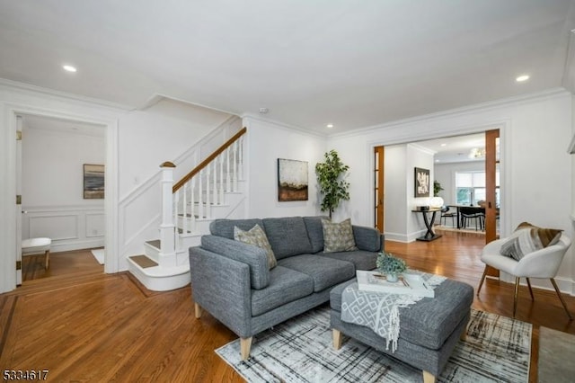 living room featuring hardwood / wood-style floors and ornamental molding