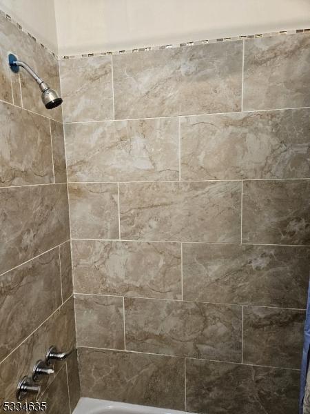 bathroom featuring shower / bath combination with curtain