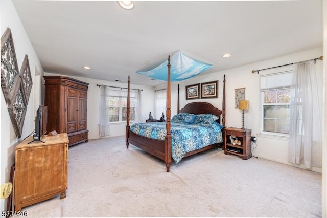 bedroom with light colored carpet