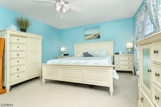 bedroom with light colored carpet and ceiling fan