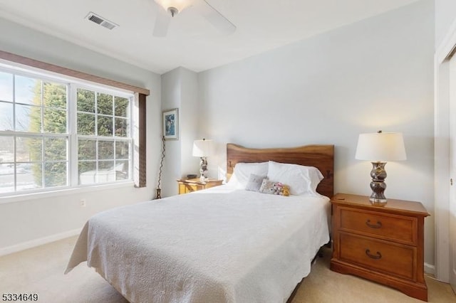 carpeted bedroom with ceiling fan