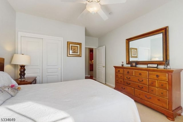 bedroom featuring light carpet, a closet, and ceiling fan