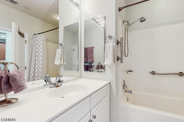 bathroom featuring vanity and shower / bath combo with shower curtain