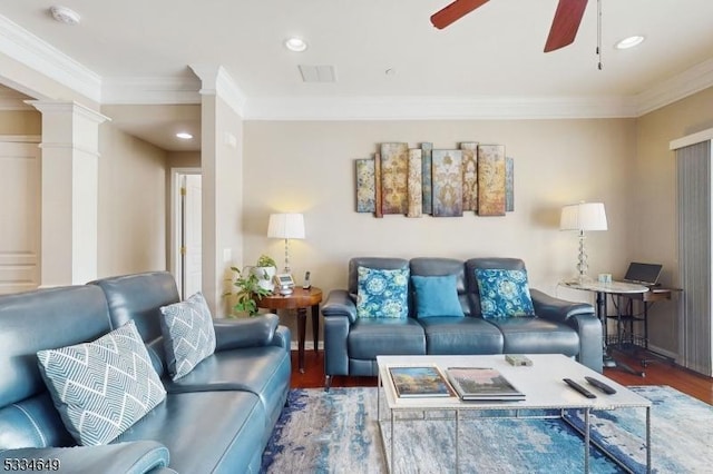 living room featuring hardwood / wood-style floors, ornamental molding, decorative columns, and ceiling fan