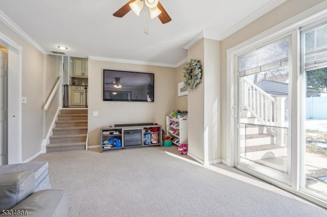 game room with ceiling fan, ornamental molding, and carpet