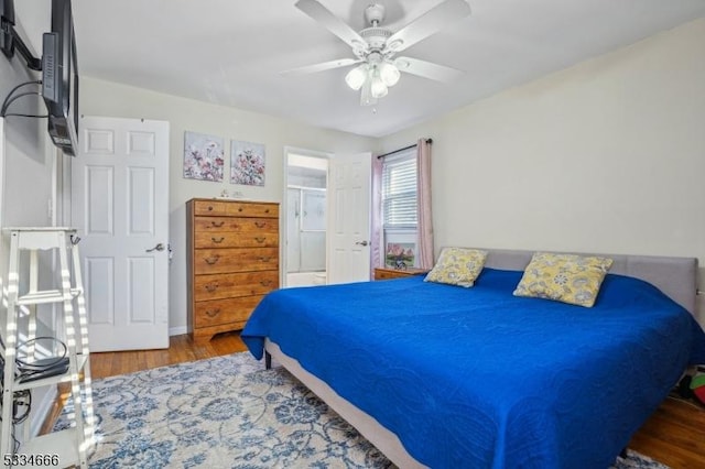 bedroom featuring hardwood / wood-style flooring and ceiling fan